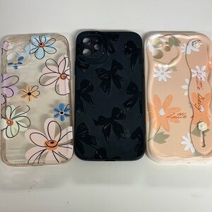 Floral and Bow Patterned Phone Cases - Black, Cream, and Clear